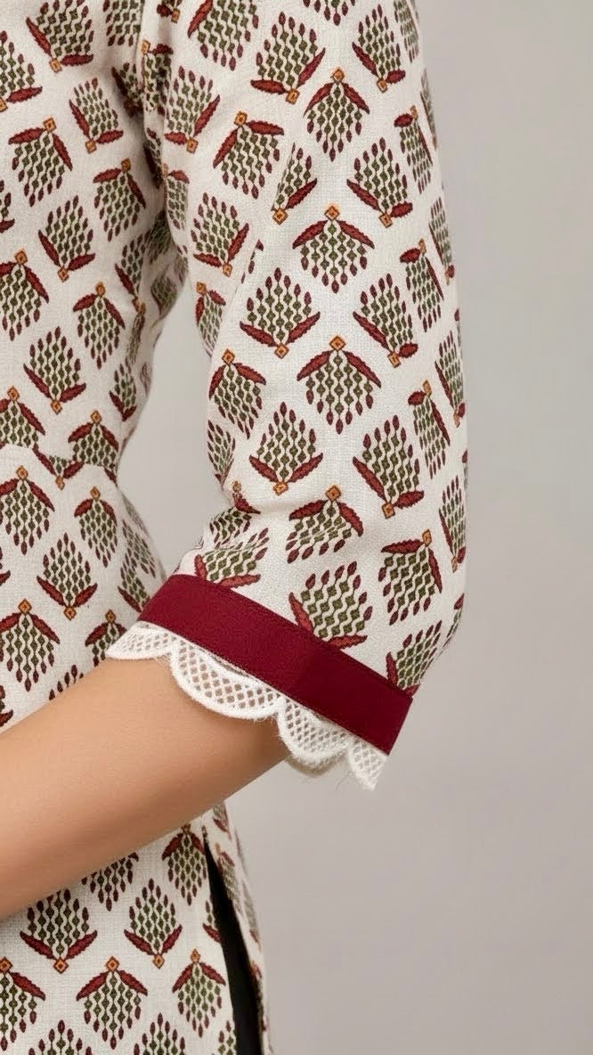 Close-up of a patterned garment with a red band on a plain background
