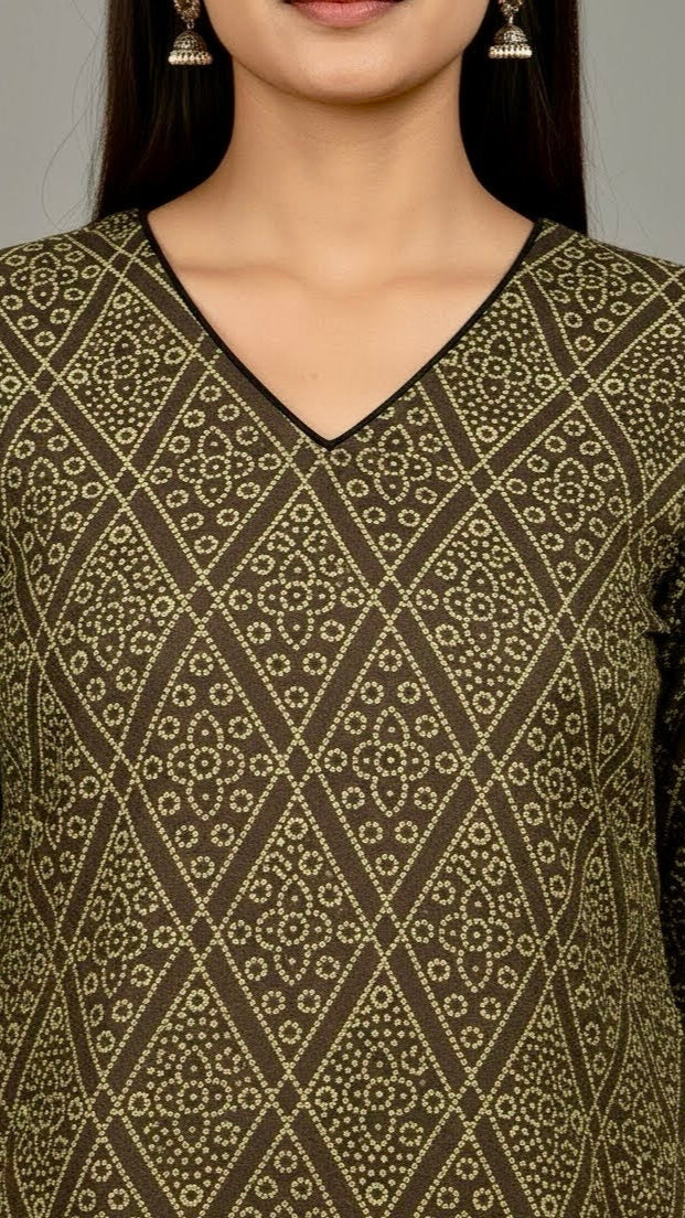 Close-up of a person wearing a patterned top with a neutral background