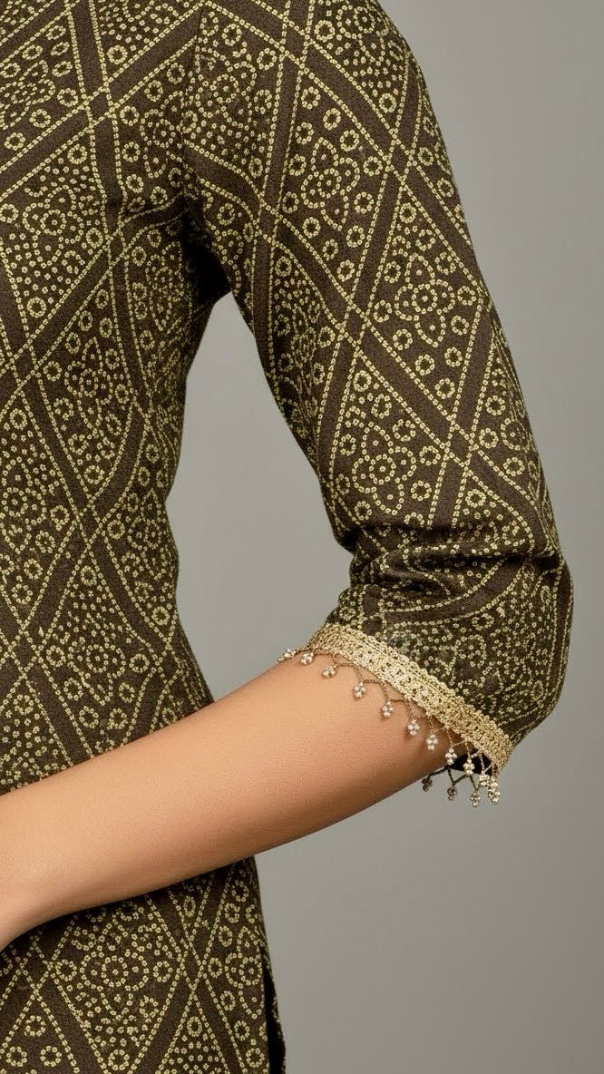 Close-up of a patterned garment with intricate design on a plain background