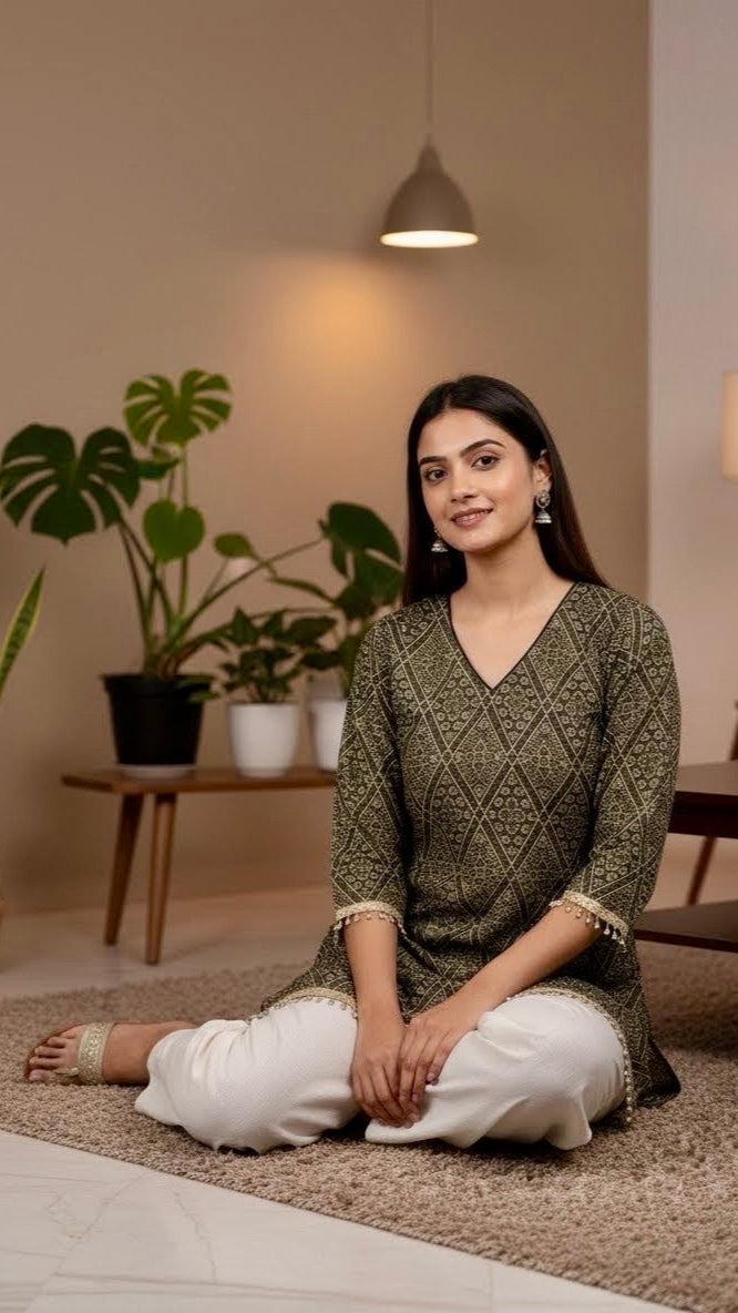 Woman sitting on a rug in a room with plants and a lamp.