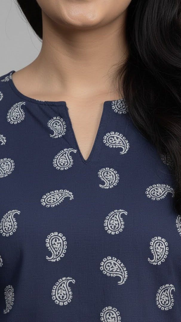 Navy blue top with white paisley pattern worn by a person
